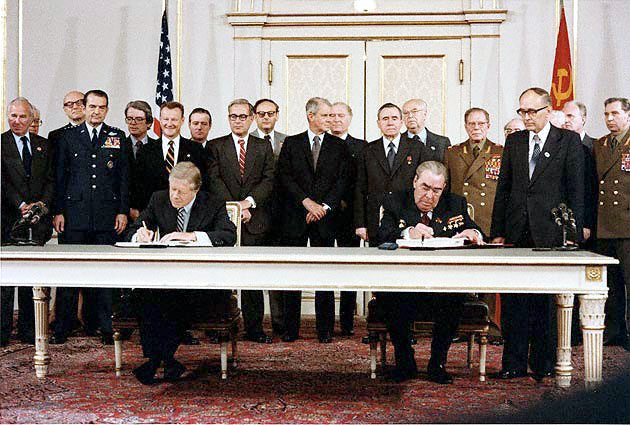 President Jimmy Carter and Soviet General Secretary Leonid Brezhnev sign the SALT II treaty in Vienna, June 18, 1979.